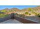 Balcony view of backyard with desert landscaping, block wall, and mountain views at 24645 N 65Th Ave, Glendale, AZ 85310