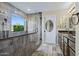 Bathroom featuring a glass-enclosed shower with showerhead and bench at 24645 N 65Th Ave, Glendale, AZ 85310