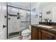 Bathroom with a new marble-walled shower, and dark fixtures at 24645 N 65Th Ave, Glendale, AZ 85310