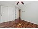 Bedroom features wood-look floors and closet with sliding doors at 24645 N 65Th Ave, Glendale, AZ 85310