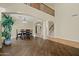 Spacious dining area featuring archways and views into the living room, creating an open and inviting space at 24645 N 65Th Ave, Glendale, AZ 85310