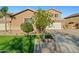 Lovely home featuring manicured lawn, desert landscaping, and inviting curb appeal at 24645 N 65Th Ave, Glendale, AZ 85310