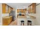 Stylish kitchen with granite countertops, stainless steel appliances, and wooden cabinets at 24645 N 65Th Ave, Glendale, AZ 85310