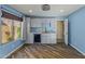 The kitchenette features bright white cabinets and stainless steel beverage cooler at 24645 N 65Th Ave, Glendale, AZ 85310