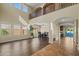 Bright living room boasts high ceilings, large windows, and a seamless transition to the dining area and pool at 24645 N 65Th Ave, Glendale, AZ 85310