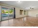 Bright living room with tile flooring, ceiling fan and access to the backyard pool at 24645 N 65Th Ave, Glendale, AZ 85310
