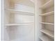 Walk-in pantry with ample white shelving for organized storage at 24645 N 65Th Ave, Glendale, AZ 85310