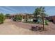 Expansive backyard featuring a pool, patio, and lush landscaping, creating an outdoor haven for leisure and entertainment at 25560 N 164Th Dr, Surprise, AZ 85387