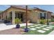 Charming backyard patio with comfortable seating and lush landscaping, perfect for outdoor relaxation and entertaining at 25560 N 164Th Dr, Surprise, AZ 85387