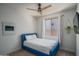 Cozy bedroom with neutral tones, a modern ceiling fan, and plenty of natural light at 25560 N 164Th Dr, Surprise, AZ 85387