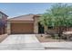 Charming single-story home featuring a well-maintained yard, tile roof, and a two-car garage at 25560 N 164Th Dr, Surprise, AZ 85387