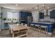 Stylish kitchen with an island, pendant lights, and stainless steel appliances, with an adjacent dining area at 25560 N 164Th Dr, Surprise, AZ 85387