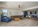 Open-concept living room features a kitchen, dining area, and stylish decor, creating a welcoming and modern living space at 25560 N 164Th Dr, Surprise, AZ 85387