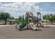 Community playground with multiple slides, climbing structures, and shaded seating area at 25560 N 164Th Dr, Surprise, AZ 85387