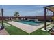 Beautiful backyard pool with a charming waterfall feature, perfect for relaxation and enjoyment at 25560 N 164Th Dr, Surprise, AZ 85387