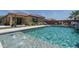 Stunning backyard pool with beautiful landscaping and lounge chairs, creating a perfect oasis for relaxation and enjoyment at 25560 N 164Th Dr, Surprise, AZ 85387