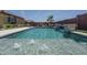 Sparkling backyard pool featuring water fountains, ideal for hot summer days and outdoor enjoyment at 25560 N 164Th Dr, Surprise, AZ 85387