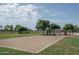 Community sand volleyball court with lush green surroundings, ready for a game at 25560 N 164Th Dr, Surprise, AZ 85387
