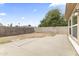 Spacious backyard featuring concrete patio and block fence for privacy at 2633 E Garnet Ave, Mesa, AZ 85204