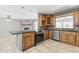 Modern kitchen with stainless steel appliances, granite countertops, ample cabinet space, and an open layout at 2633 E Garnet Ave, Mesa, AZ 85204