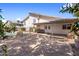 A large backyard with a covered patio, a mature tree, and a fenced swimming pool at 2755 W Calle Del Norte --, Chandler, AZ 85224