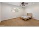 Simple bedroom with neutral carpet, a window for natural light, and ceiling fan at 2755 W Calle Del Norte --, Chandler, AZ 85224