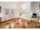Light-filled dining area with a double-door entrance and view of the living area at 2755 W Calle Del Norte --, Chandler, AZ 85224