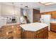 Open-concept kitchen featuring a large island and view of the staircase at 2755 W Calle Del Norte --, Chandler, AZ 85224