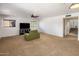 Cozy living room with neutral carpet, ceiling fan, and plenty of natural light at 2755 W Calle Del Norte --, Chandler, AZ 85224