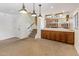Open living space with a staircase and custom wet bar, perfect for entertaining at 2755 W Calle Del Norte --, Chandler, AZ 85224