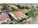 Aerial view of home featuring a sparkling swimming pool, patio, and landscaped backyard at 29302 N 126Th Ln, Peoria, AZ 85383
