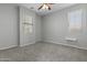 Bedroom showcasing natural light through large windows and a ceiling fan at 29302 N 126Th Ln, Peoria, AZ 85383