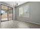 Dining area with sliding glass doors that provide access to the outdoor patio at 29302 N 126Th Ln, Peoria, AZ 85383