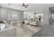 Inviting living area open to the kitchen and dining with abundant natural light at 29302 N 126Th Ln, Peoria, AZ 85383
