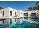 Stunning backyard pool reflecting the home's architecture under a bright blue sky at 3186 E Stella Ln, Phoenix, AZ 85016