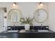 Modern bathroom vanity with dual sinks, round mirrors, and elegant fixtures at 3186 E Stella Ln, Phoenix, AZ 85016