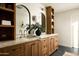 Bathroom features double vanity with wood cabinets and stylish marble countertops at 3186 E Stella Ln, Phoenix, AZ 85016