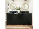 Dark wood bathroom vanity with double sinks, round mirrors, and stylish lighting at 3186 E Stella Ln, Phoenix, AZ 85016
