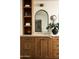 Stylish bathroom vanity with wood cabinets, marble countertop, vessel sink, and decorative mirror at 3186 E Stella Ln, Phoenix, AZ 85016