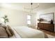 Well-lit bedroom with modern decor, hardwood floors, and a neutral color palette at 3186 E Stella Ln, Phoenix, AZ 85016
