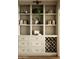 Elegant built-in shelves featuring decor and a wine rack at 3186 E Stella Ln, Phoenix, AZ 85016