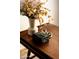 Stylish table decor features a vase with foliage and a black stone box at 3186 E Stella Ln, Phoenix, AZ 85016