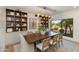 Elegant dining room showcases custom built-in shelving and a large picture window at 3186 E Stella Ln, Phoenix, AZ 85016