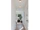 Hallway leading into a beautifully furnished bedroom with large windows and natural light at 3186 E Stella Ln, Phoenix, AZ 85016