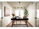 Bright home office featuring a modern desk, stylish lighting, and neutral decor at 3186 E Stella Ln, Phoenix, AZ 85016