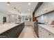 Open kitchen features a large center island, stainless steel appliances, and stylish countertops at 3186 E Stella Ln, Phoenix, AZ 85016