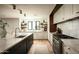 Open-concept kitchen featuring a large island, modern appliances, and stylish decor at 3186 E Stella Ln, Phoenix, AZ 85016