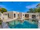Beautiful backyard oasis featuring a refreshing pool, lounge chairs, and stylish white stucco architecture at 3186 E Stella Ln, Phoenix, AZ 85016