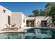 Beautiful pool area with lounge chairs and views of the home's unique architecture at 3186 E Stella Ln, Phoenix, AZ 85016