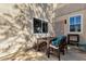Backyard featuring an outdoor dining set, textured stucco wall and views of the backyard at 3221 N 37Th St # 10, Phoenix, AZ 85018